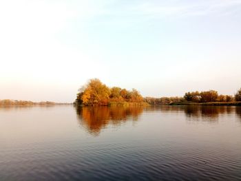 Scenic view of lake against sky during autumn