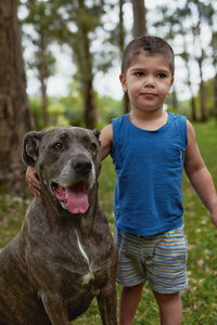 Portrait of boy with dog