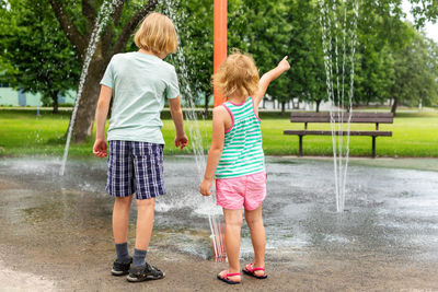 Kids playing with fountain