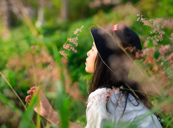 Woman wearing hat on field