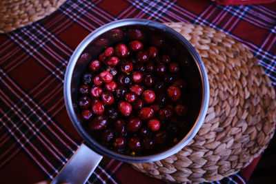 High angle view of strawberries in bowl on table