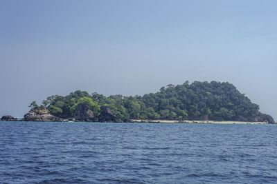 Scenic view of sea against clear blue sky