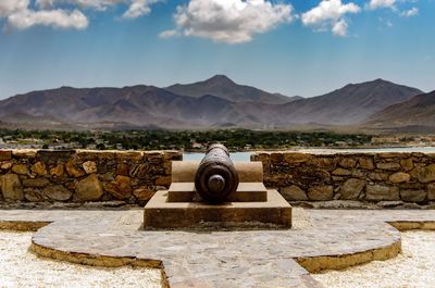 Landscape with mountain range in background