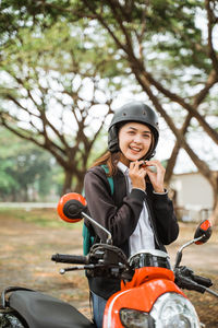 Portrait of young woman using mobile phone