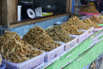 Crispy shrimps, crispy crabs and fried fish sold at food stands at glagah beach in kulonprogo