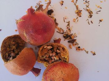 Close-up of dry pomegranate against white background