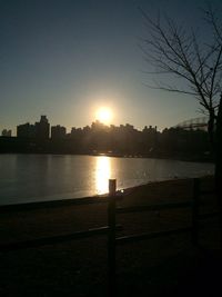 Scenic view of river at sunset