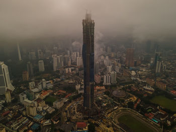 High angle view of modern buildings in city against sky