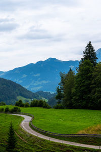 Scenic view of landscape and mountains against sky