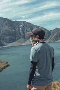 Rear view of man looking at mountains