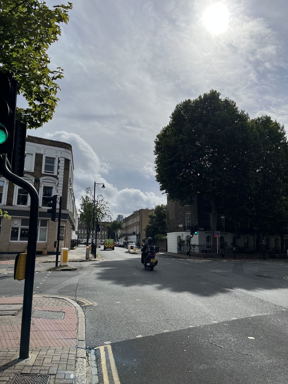 Tree Road Street Sign City Sky Plant Transportation Nature Architecture Lane Lighting Cloud Road Sign Symbol Road Marking Day Stoplight Building Exterior Light