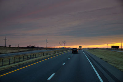 Highway against sky during sunset