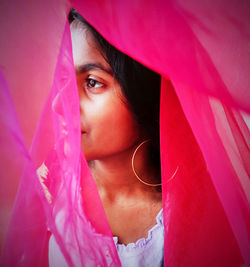 Close-up of girl seen through textile