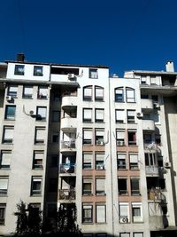 Low angle view of residential building against clear sky