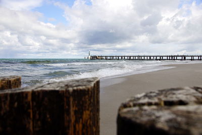 Pier over sea against sky