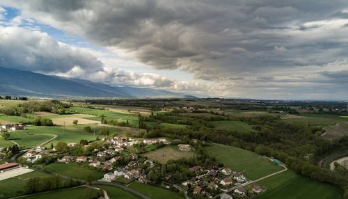 Scenic view of landscape against dramatic sky