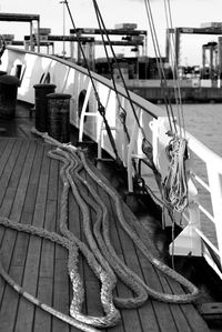 Close-up of sailboats moored at harbor