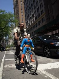 Man riding motorcycle on street in city