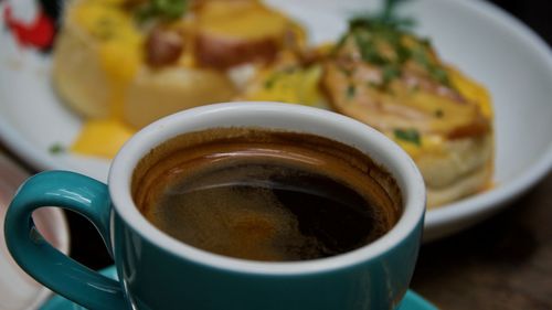 Close-up of coffee cup on table