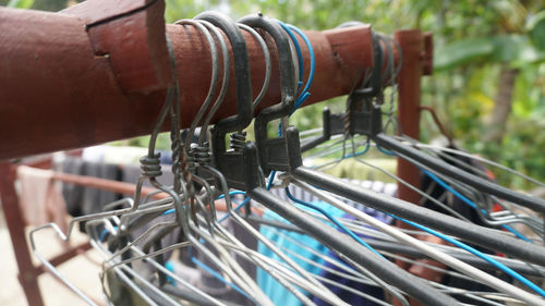 Close-up of bicycle hanging on metal