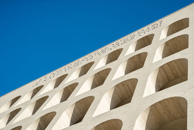 Low angle view of building against blue sky