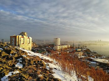 High angle view of buildings against sky during winter