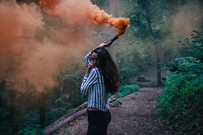 Full length of woman standing in park