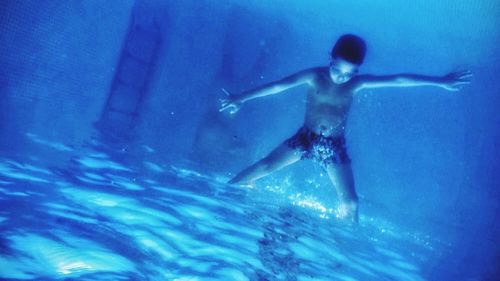 Boy playing in water
