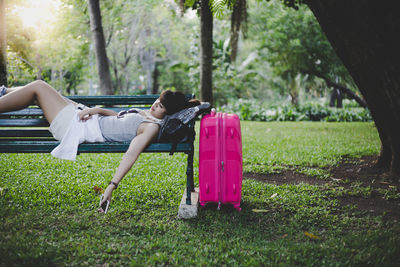 Side view of woman lying down on land