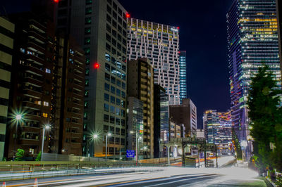 Illuminated buildings in city at night