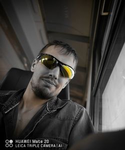 Portrait of young man wearing sunglasses