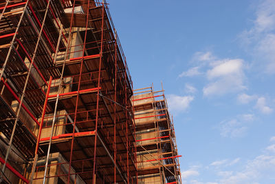 Low angle view of construction site against sky