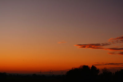 Scenic view of silhouette landscape against romantic sky at sunset