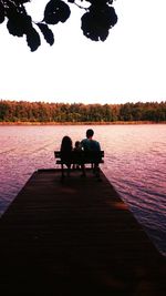 Two people relaxing in lake