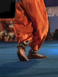 Low section of woman dancing on stage