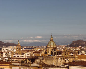 Buildings in city against sky