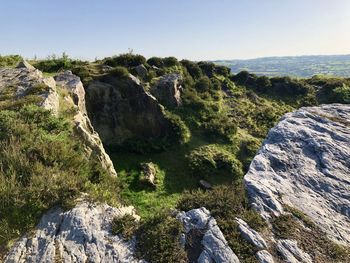 Scenic view of rocks against clear sky