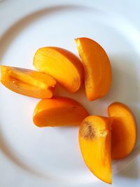 High angle view of orange fruit in plate
