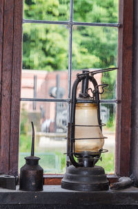 Antique lanterns on window sill at old home