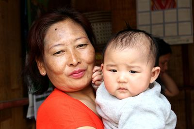 Portrait of mother with baby