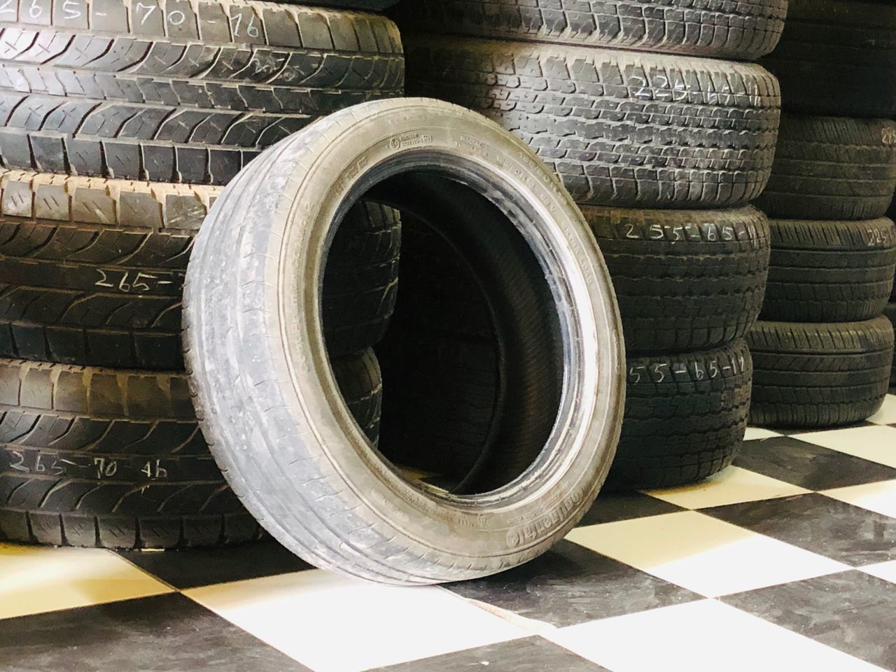 CLOSE-UP OF STACK OF TIRE