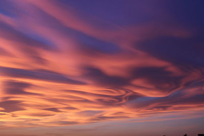 Low angle view of dramatic sky during sunset