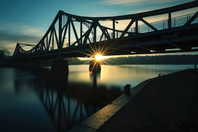 Potsdam-glienicke bridge between potsdam and berlin  over river havel during sunrise 