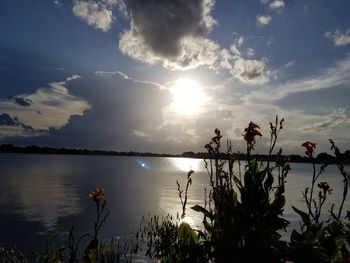 Scenic view of lake against sky during sunset