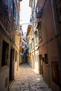 Narrow alley amidst buildings in city