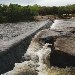 Scenic view of river flowing through rocks