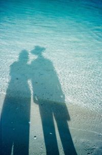 Shadow of people in water