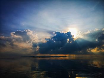 Scenic view of sea against sky at sunset