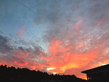 Low angle view of dramatic sky at sunset