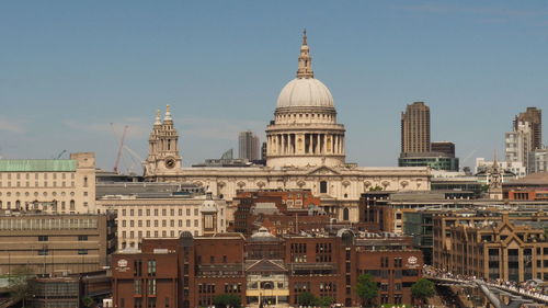 Buildings in city against sky